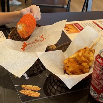 Hot Juicy 88 - Fire Cheetos covered Mozzarella Corndog on left, Half Mozzarella and Half Hot Dog with Potato Crust on right - sooooo good!!! - Korean Near Me - Aurora, Colorado Hot Juicy 88 - Fire Cheetos covered Mozzarella Corndog on left, Half Mozzarella and Half Hot Dog with Potato Crust on right - sooooo good!!! - Korean Near Me - Aurora, Colorado