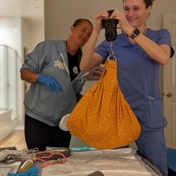 My Earth Birth Midwifery - Coley and Lee Ann checking baby's weight