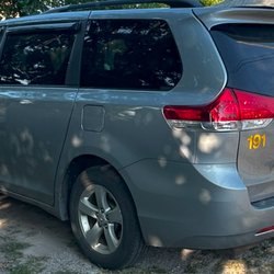 AM PM 24-7 Taxi Service - Toyota seinna side picture.