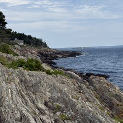 Land's End Beach - Rocky coastline on left side.