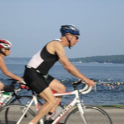 Bigfoot Triathlon - You can see swimmers in the lake and bikers riding beside them.