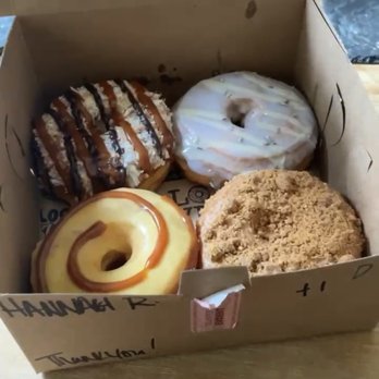 Hook And Press Donuts - (Clockwise) Samoa, Lavender lemonade, Cinnamon Crumb, Passion Fruit Caramel donuts. (4 Pack of Donuts) - Donuts Near Me - Santa Barbara, California