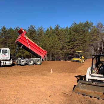 Sanchez Lawn Care Services - a dump truck and a bulldozer - Landscaping Near Me Sanchez Lawn Care Services - a dump truck and a bulldozer - Landscaping Near Me