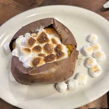 Texas Roadhouse - Sweet Potato with cinnamon butter and marshmallows - Steakhouses Near Me - East Meadow, New York Texas Roadhouse - Sweet Potato with cinnamon butter and marshmallows - Steakhouses Near Me - East Meadow, New York