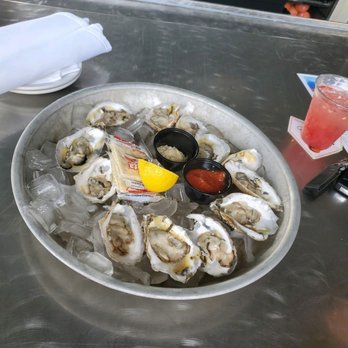 Skye Bar & Grille - Dozen of oysters round 1 - Bars Near Me - Ocean City, Maryland Skye Bar & Grille - Dozen of oysters round 1 - Bars Near Me - Ocean City, Maryland