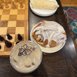 Egg and sausage burrito, giant cinnamon roll, chai latte Egg and sausage burrito, giant cinnamon roll, chai latte