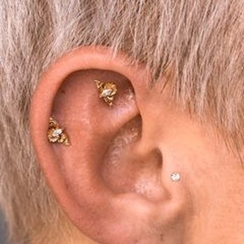 DV8 Tattoo and Body Piercing - The start of my curated ear. Jewelry is from their in-house line au.adore. Jane is designing a chain to connect the two helix piercings - Tattoo Near Me - Roseville, California DV8 Tattoo and Body Piercing - The start of my curated ear. Jewelry is from their in-house line au.adore. Jane is designing a chain to connect the two helix piercings - Tattoo Near Me - Roseville, California
