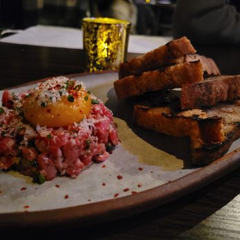 Sparrow + Wolf - Grass fed beef tartare, egg yolk, grilled sourdough $20 Bland. Needed flakey salt. - New American Near Me - Las Vegas, Nevada Sparrow + Wolf - Grass fed beef tartare, egg yolk, grilled sourdough $20 Bland. Needed flakey salt. - New American Near Me - Las Vegas, Nevada