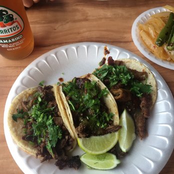 Lilly's Tacos - 2 carne asada tacos, 1 tripa, with cilantro, dark red and green salsa, and lime. $1.00 for grilled onions with grilled chile serrano. - Mexican Near Me - Goleta, California Lilly's Tacos - 2 carne asada tacos, 1 tripa, with cilantro, dark red and green salsa, and lime. $1.00 for grilled onions with grilled chile serrano. - Mexican Near Me - Goleta, California