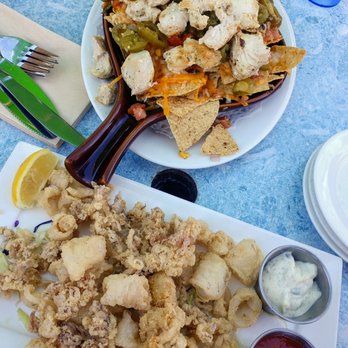 Quinn's Lighthouse - Quinn's Nacho Chip Platter with guacamole and chicken. Monterey Deep Fried Calamari with tartar and spicy red cocktail sauce. - Seafood Near Me - Oakland, California Quinn's Lighthouse - Quinn's Nacho Chip Platter with guacamole and chicken. Monterey Deep Fried Calamari with tartar and spicy red cocktail sauce. - Seafood Near Me - Oakland, California