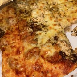 Italian Fiesta Pizzeria - Jerk chicken on the right was decent