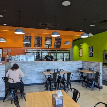 Clean Eatz - a woman sitting at a table - Cafes Near Me - Centreville, Virginia Clean Eatz - a woman sitting at a table - Cafes Near Me - Centreville, Virginia