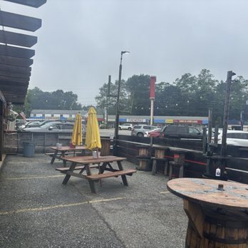 Chop Shop Pub - This is the view in the outdoor dining area of the strip mall next door with Chris's comics, leather and Lace , a tattoo parlor etc ! - Bars Near Me - Seabrook, New Hampshire