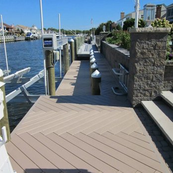 Advanced Marine Construction - a wooden dock with steps and railings - General Contractors Near Me - Brick, New Jersey Advanced Marine Construction - a wooden dock with steps and railings - General Contractors Near Me - Brick, New Jersey