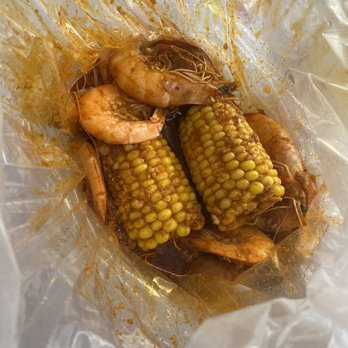The Crawfish - This is the $9 meal 1/2 pound of shrimp and corn add potatoes and walah!   Ps. That juice it's boiled in #my new number 1 all time fave - Cajun/Creole Near Me - Sylmar, California