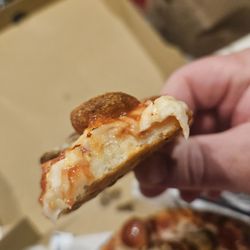 Delish Pizza - It was ok. I tried Delish for the 1st time. I ordered well-done pizza, and you can clearly see that the dough is still undercooked.