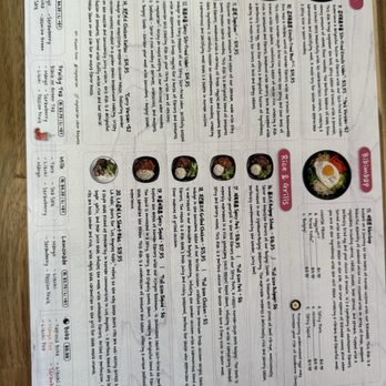 Sharon Korean Kitchen - A Korean restaurant menu showcases a selection of rice and grill dishes, each accompanied by a photograph and detailed description. The menu includes items such as spicy pork, grilled chicken, and beef, with prices ranging from $4.95 to $15.05. It also features a section for rice and grill combos, with options like LA short ribs and chicken, along with side dishes and beverages. The menu is printed on white paper with pink accents and includes contact information for the restaurant. - Korean Near Me - Boston, Massachusetts