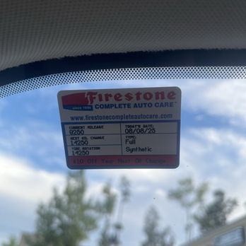 Firestone Complete Auto Care - Sticker for a completed oil change that I didn't request, where they incorrectly reinstalled the cover upside down. - Tires Near Me - Charlotte, North Carolina