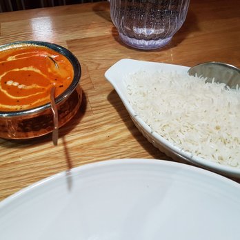 Indian Haveli - Butter chicken with rice, before I made a mess on the the larger plate and soped up the curry with paratha. - Indian Near Me - Surrey, British Columbia Indian Haveli - Butter chicken with rice, before I made a mess on the the larger plate and soped up the curry with paratha. - Indian Near Me - Surrey, British Columbia