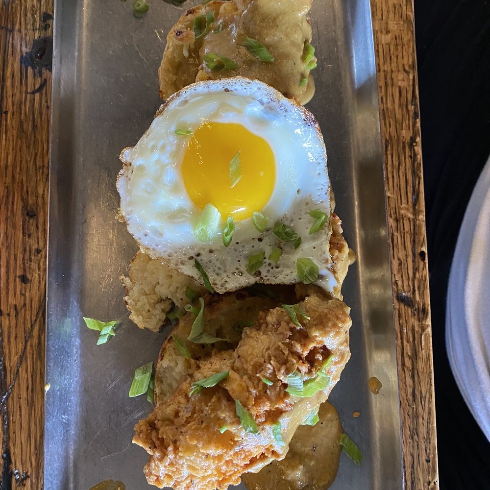 Thistle Draftshop - Fried chicken breast over biscuits with a fried egg - Beer, Wine & Spirits Near Me - Spring, Texas Thistle Draftshop - Fried chicken breast over biscuits with a fried egg - Beer, Wine & Spirits Near Me - Spring, Texas