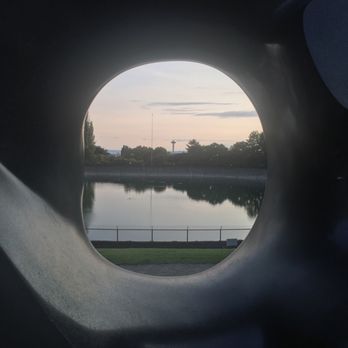Volunteer Park - View of the Space Needle through the Black Sun sculpture - Parks Near Me - Seattle, Washington