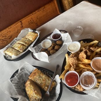 Storming Crab - An array of fried foods. Boudin balls seafood bread fried gator and fries - Seafood Near Me - Fort Wayne, Indiana