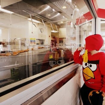 Krispy Kreme - Watching the donuts being made when the hot light is on. - Donuts Near Me - Concord, California