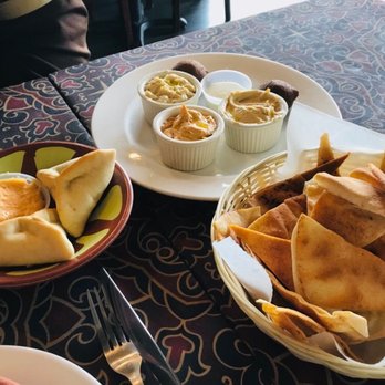 Cafe Baladi - On the left: cheese fatayer (baked dough filled with cheese, onion, spinach and spices) On the right: Baladi sampler with beef kibbeh - Lebanese Near Me - Malvern, Pennsylvania Cafe Baladi - On the left: cheese fatayer (baked dough filled with cheese, onion, spinach and spices) On the right: Baladi sampler with beef kibbeh - Lebanese Near Me - Malvern, Pennsylvania