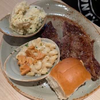 Pappas Delta Blues Smokehouse - Steak with a side of potato salad and macaroni - Smokehouse Near Me - Webster, Texas Pappas Delta Blues Smokehouse - Steak with a side of potato salad and macaroni - Smokehouse Near Me - Webster, Texas