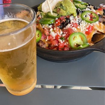 Wooly's - Skillet nachos with carne asada and cold beer - Seafood Near Me - Pismo Beach, California
