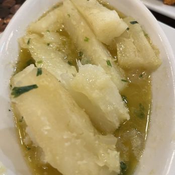 El Rincon Tropical - My absolute favorite yuca con mojo de ajo... so, so, good. A must to order. - Puerto Rican Near Me - Virginia Beach, Virginia
