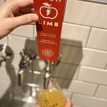 High Limb Cider - a hand holding a beer - Cideries Near Me - Plymouth, Massachusetts
