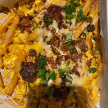 Twin Peaks - Loaded bacon fries and a few drinks to start. - Sports Bars Near Me - Oakbrook Terrace, Illinois Twin Peaks - Loaded bacon fries and a few drinks to start. - Sports Bars Near Me - Oakbrook Terrace, Illinois