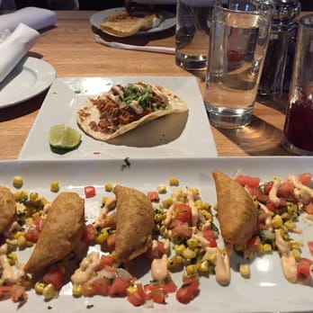 Malo - chicken tinga taco up top // empanadas down below // & the last of a roja sangria. - Latin American Near Me - Des Moines, Iowa Malo - chicken tinga taco up top // empanadas down below // & the last of a roja sangria. - Latin American Near Me - Des Moines, Iowa