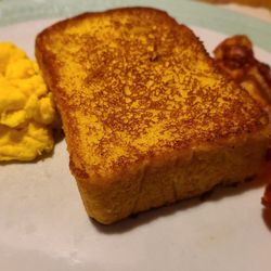 Metro 29 Diner Restaurant - Close up of French toast with eggs and bacon.