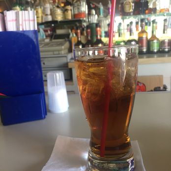 Bell Bar - a drink in a tall glass with a red straw - Pubs Near Me - Bay City, Michigan