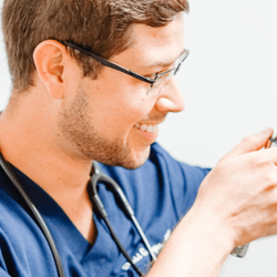 Modern Medicine AZ - Dr. Gallegos examining a patient's ear