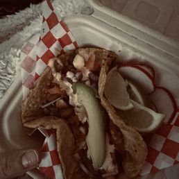 This is a shrimp taco well done with homemade tortillas This is a shrimp taco well done with homemade tortillas