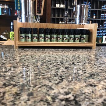 Steep Station - a bar counter with bottles of liquor - Tea Rooms Near Me - Tampa, Florida