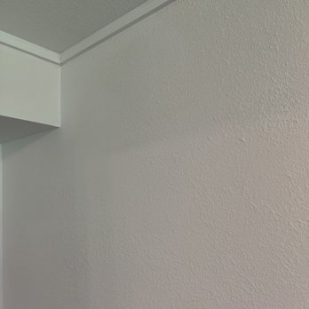 Millerz Construction - Crisp corner and edge of bulkhead they built to hide some pipes - General Contractors Near Me