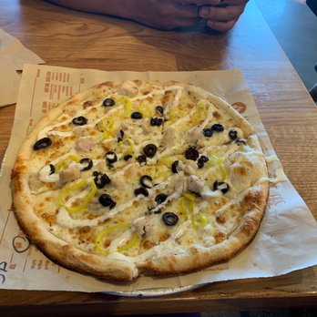 Blaze Pizza - Build your own pizza with banana peppers, black olives, chicken and pesto with ranch drizzle. - Salad Near Me - Reno, Nevada