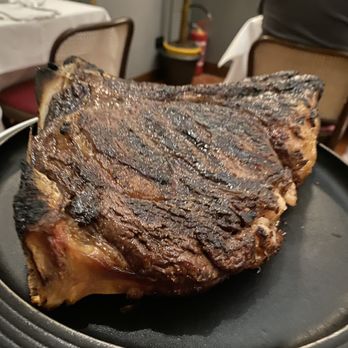 Regina Bistecca - Cooked steak before they carve it for table. - Italian Near Me - Florence, FI Regina Bistecca - Cooked steak before they carve it for table. - Italian Near Me - Florence, FI
