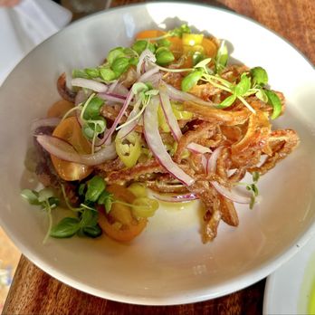 Casa Mono - Crispy pig ears with Sun gold tomatoes, and smoked maple vinaigrette - Spanish Near Me - New York, New York Casa Mono - Crispy pig ears with Sun gold tomatoes, and smoked maple vinaigrette - Spanish Near Me - New York, New York