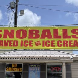 a sign for a shave ice and ice cream shop a sign for a shave ice and ice cream shop