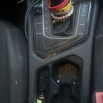 Nevo - Middle console before - Auto Detailing Near Me Nevo - Middle console before - Auto Detailing Near Me