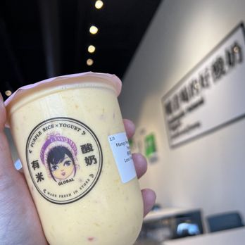 Yomie's Rice X Yogurt - Katy - a hand holding a cup of yogurt - Ice Cream & Frozen Yogurt Near Me - Katy, Texas Yomie's Rice X Yogurt - Katy - a hand holding a cup of yogurt - Ice Cream & Frozen Yogurt Near Me - Katy, Texas