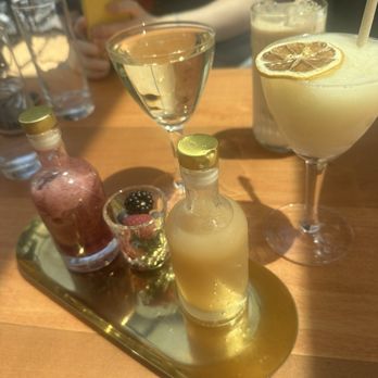 Glass Ceiling Rooftop - Mimosa with berry compote and pear juice, iced latte, and frozen lemon drop - Lounges Near Me - New York, New York