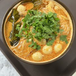 Khaopoon: Coconut red curry chicken soup, chicken breast, quail eggs, bamboo, green onion, cilantro, and rice vermicelli noodles (med-spicy)