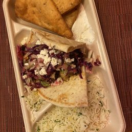 Kids pita -grilled chicken -cabbage slaw -crumbled feta -pita chips  -tzatziki  -saffron basmati rice -lemon-herb tahini