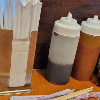 Pho King - a number of condiments on a table - Vietnamese Near Me - Tacoma, Washington Pho King - a number of condiments on a table - Vietnamese Near Me - Tacoma, Washington